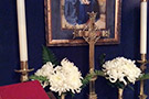 Chapel altar with cross candles and flowers