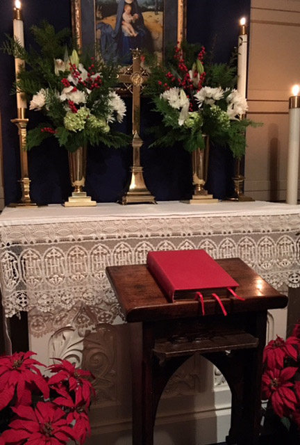 Chapel altar with cross candles and Bible
