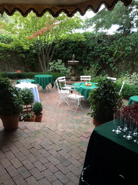 Tables and chairs set up in a courtyard
